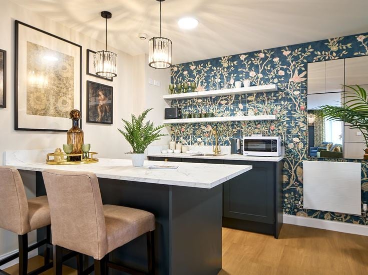 a kitchen with a table and chairs