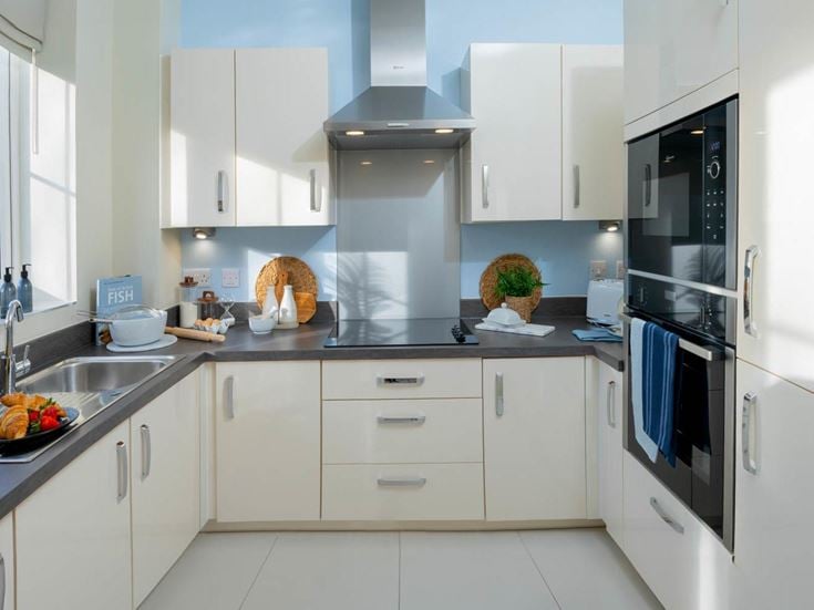 a kitchen with white cabinets