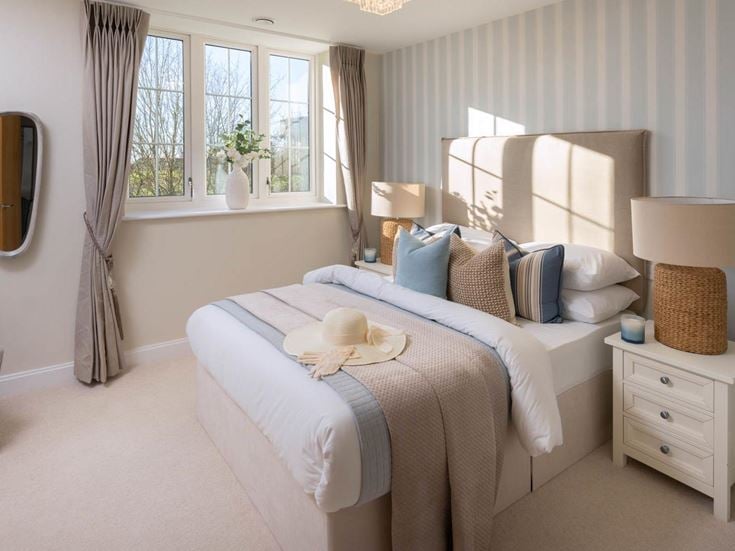 a bedroom with a bed and a mirror