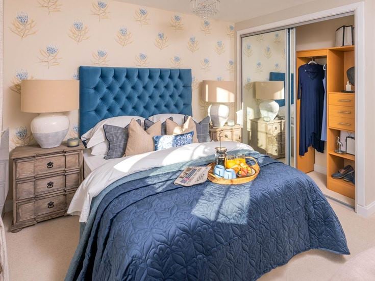 a bedroom with a bed and dresser