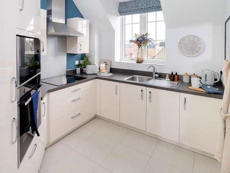a kitchen with white cabinets