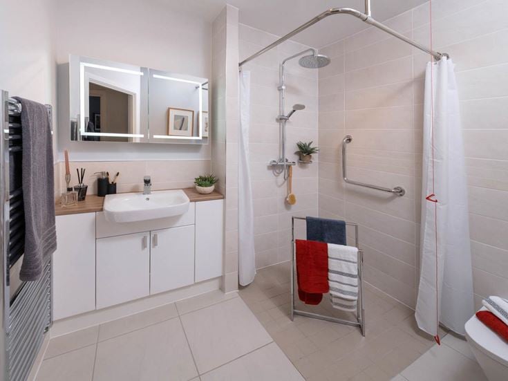a bathroom with a shower and sink