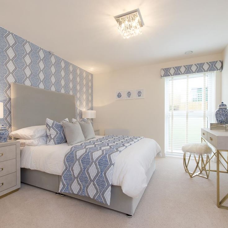 a bedroom with a bed and a table
