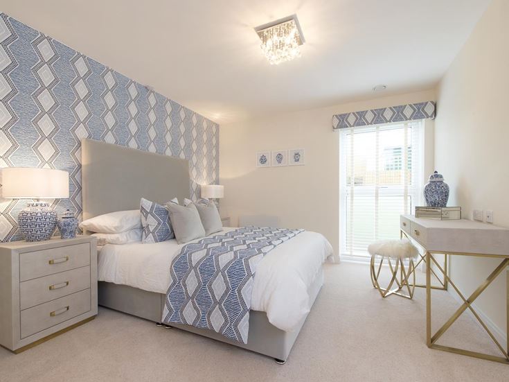 a bedroom with a bed and a table