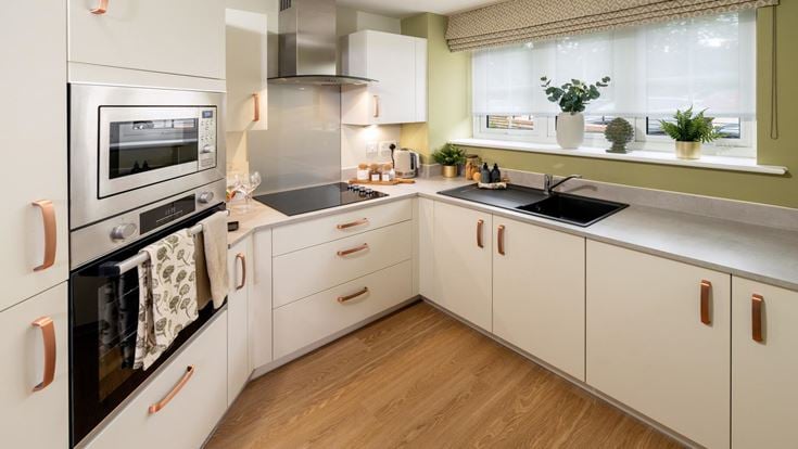 a kitchen with white cabinets