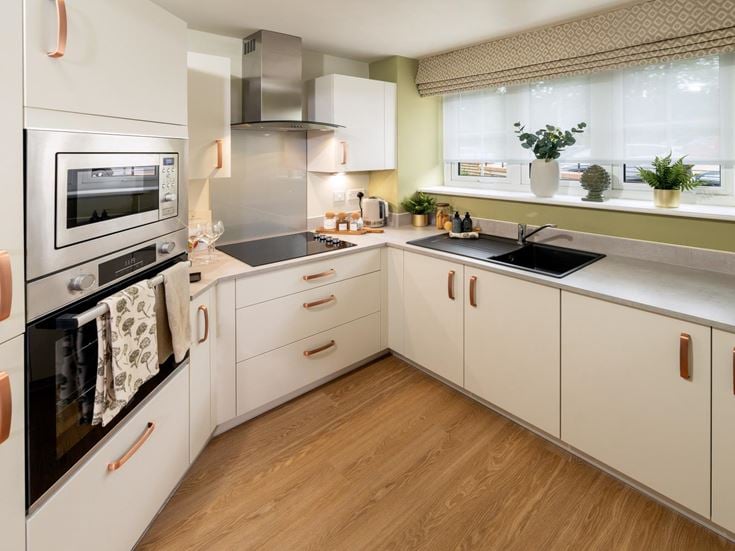 a kitchen with white cabinets