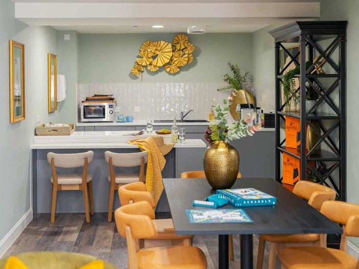 a kitchen with a table and chairs