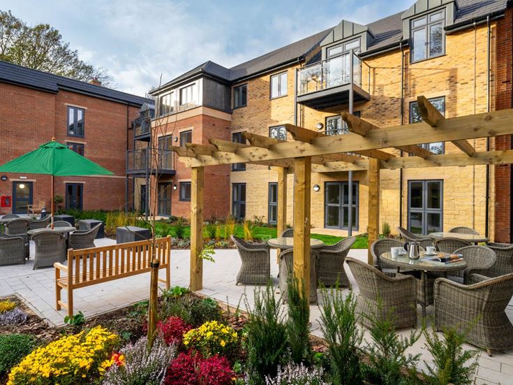 a courtyard with tables and chairs