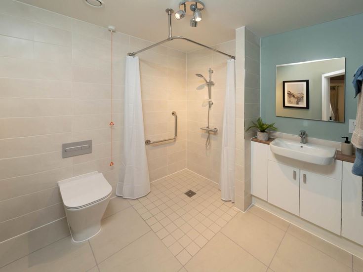 a bathroom with a shower and toilet