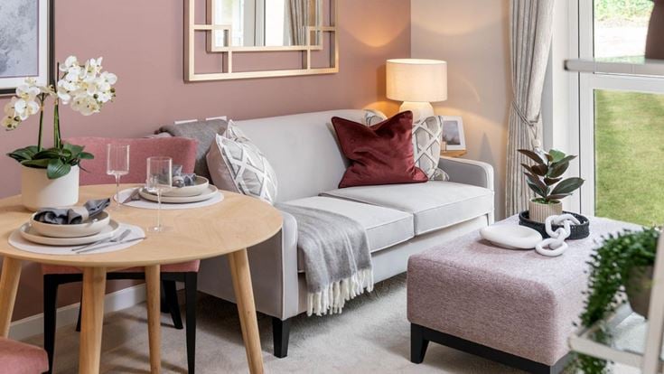 a living room with a couch and a table