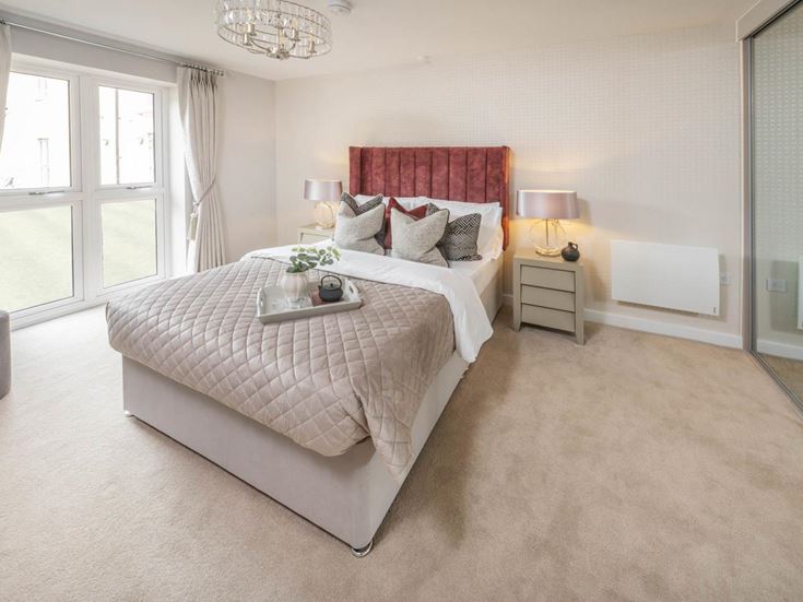 a bedroom with a bed and a table
