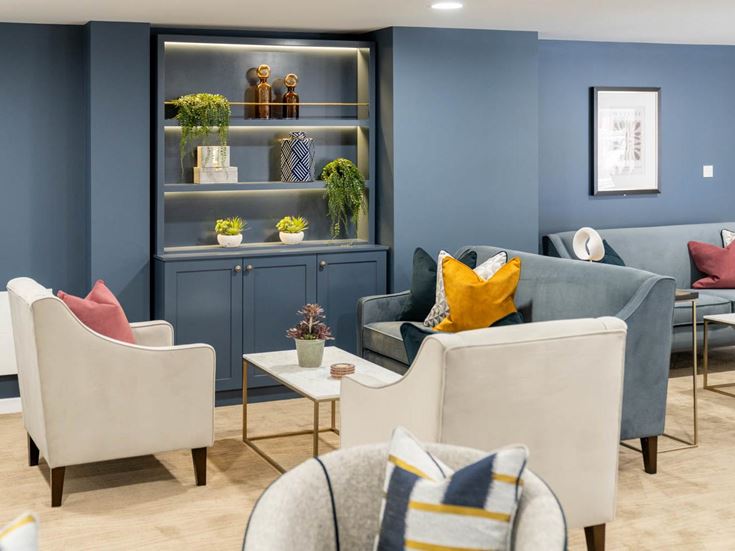 a living room with a blue wall