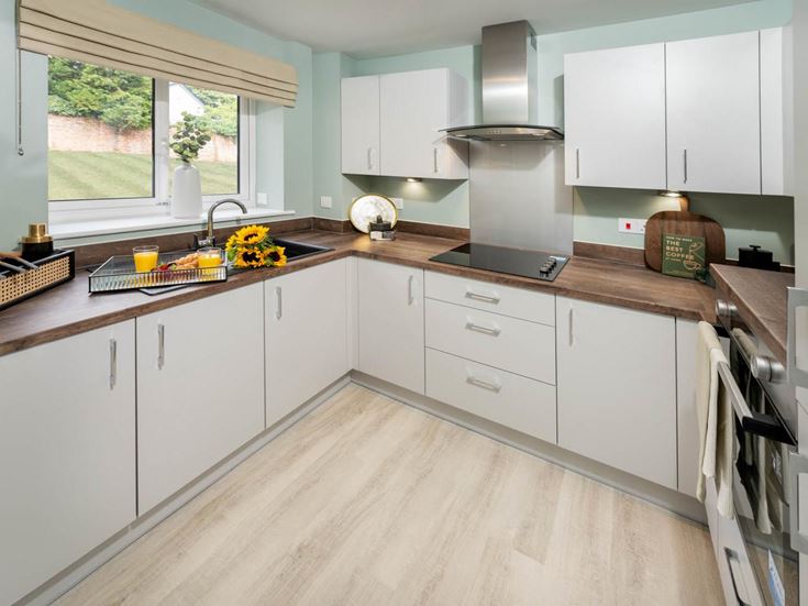 a kitchen with white cabinets