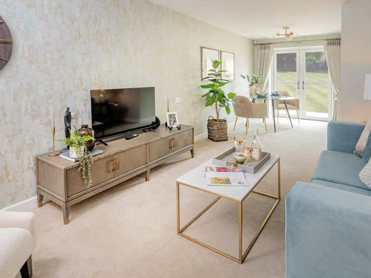 a living room with a tv and couches
