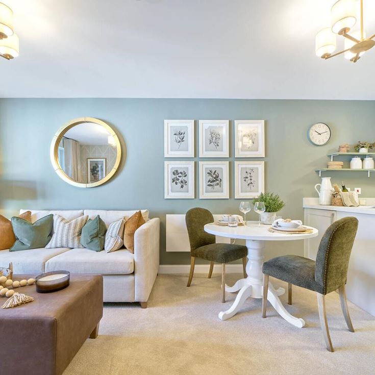 a living room with a table and chairs