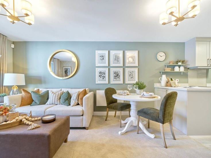 a living room with a table and chairs