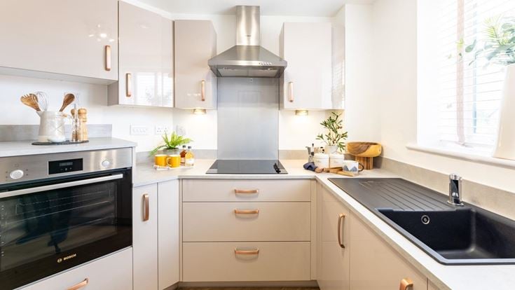 a kitchen with white cabinets