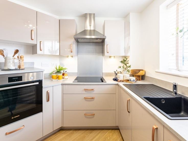 a kitchen with white cabinets