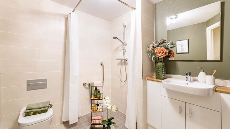 a bathroom with a shower and sink