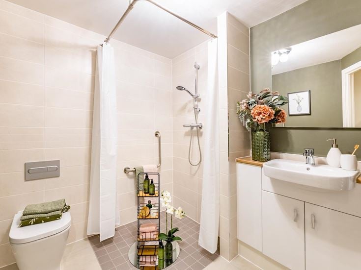 a bathroom with a shower and sink