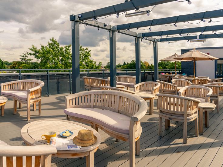 a patio with tables and chairs