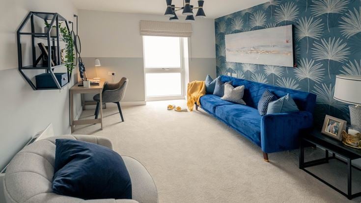 a living room with a blue couch