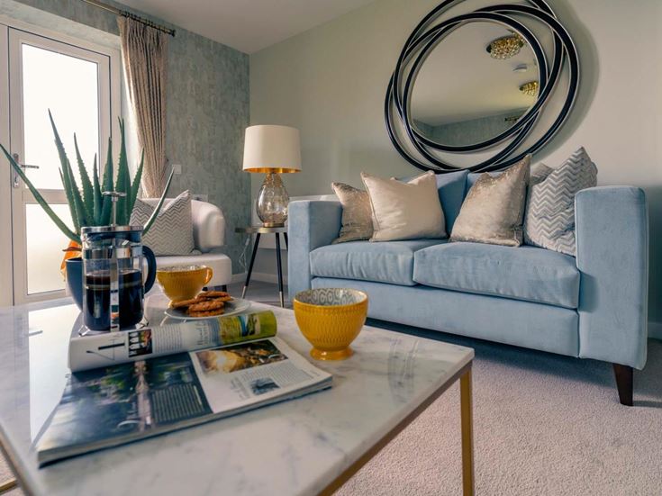 a living room with a blue couch