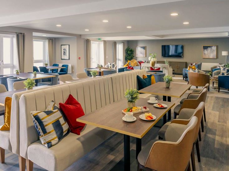 a room with a table chairs and a couch