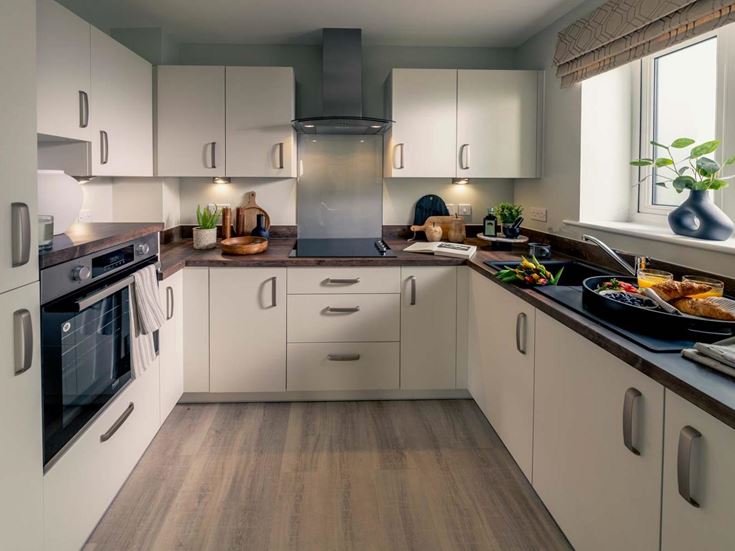 a kitchen with white cabinets