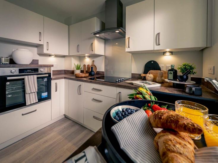 a kitchen with white cabinets