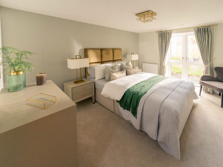 a bedroom with a bed and a desk