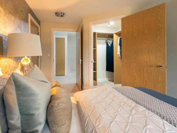 a bedroom with a bed and a closet