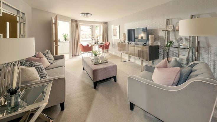 a living room with a large sofa and a television