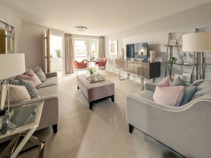 a living room with a large sofa and a television