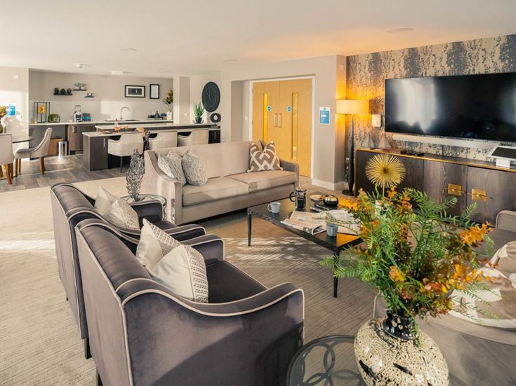 a living room with a large screen