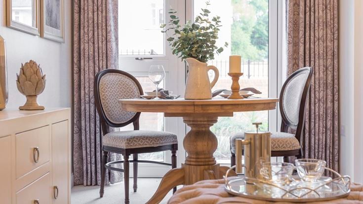 a table with a vase and a vase on it