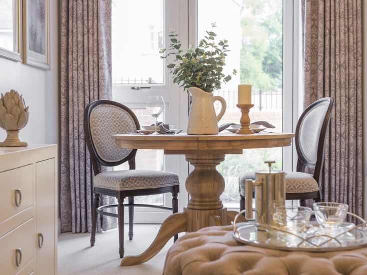a table with a vase and a vase on it