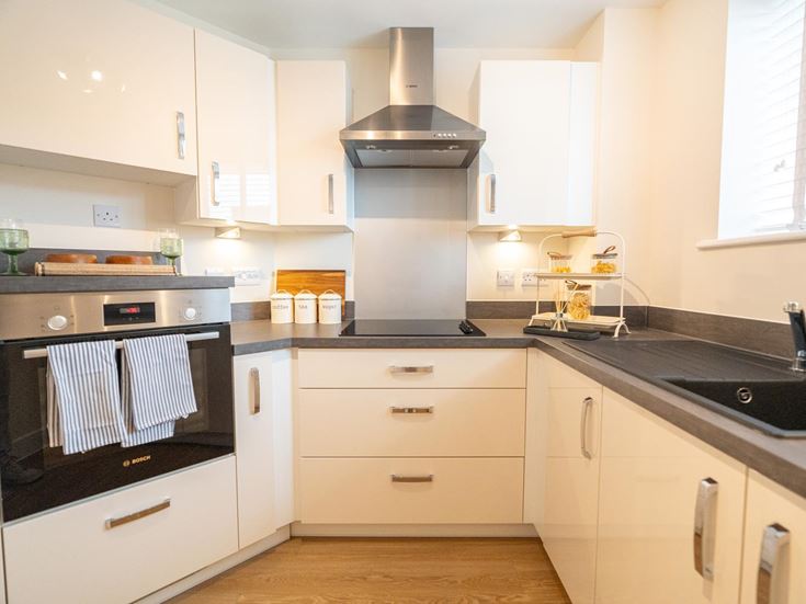 a kitchen with white cabinets