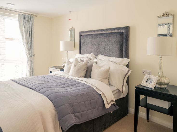 a bed with a white bed spread