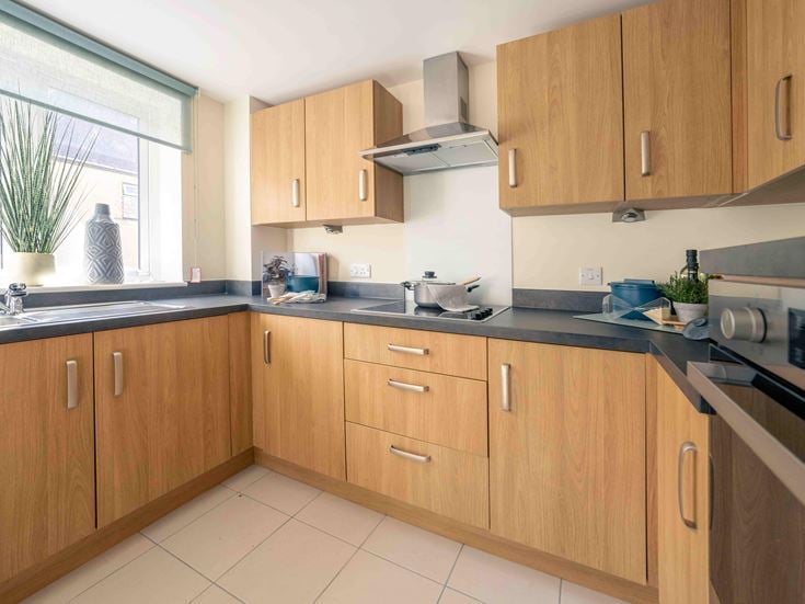 a kitchen with wooden cabinets