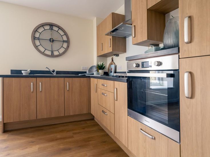 a kitchen with wooden cabinets