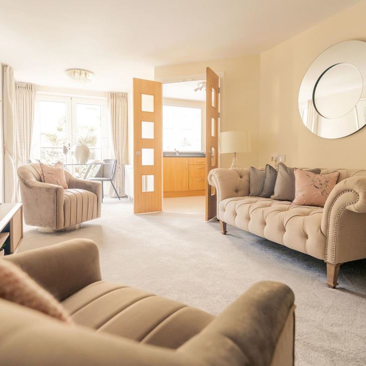 a living room with a large mirror