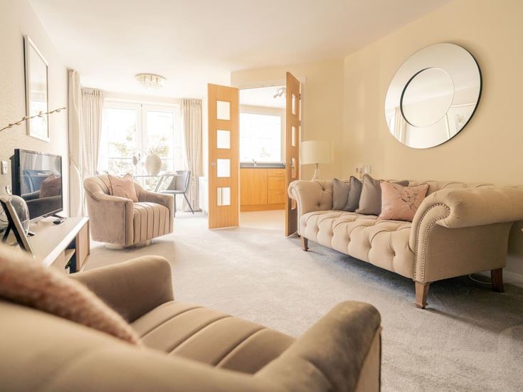 a living room with a large mirror