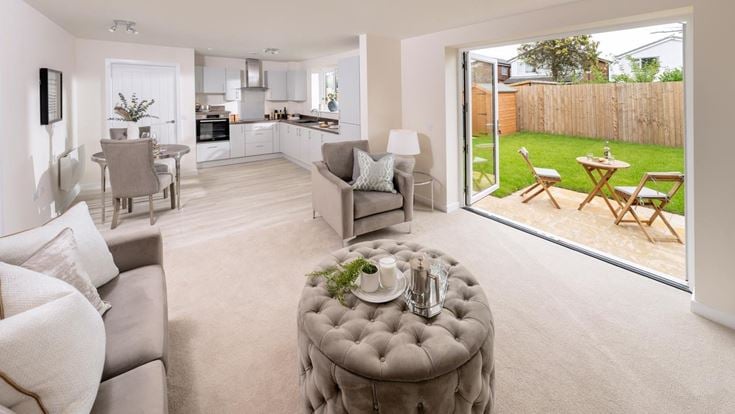 a living room with a large glass door