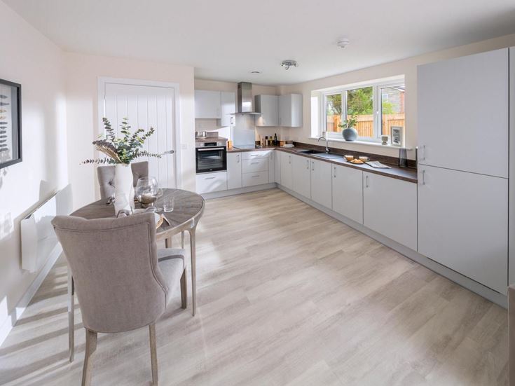 a kitchen with white cabinets