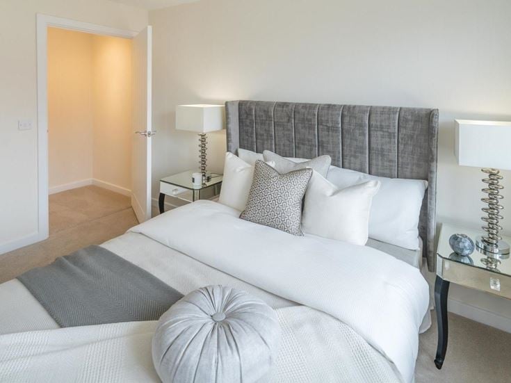 a bed with white pillows
