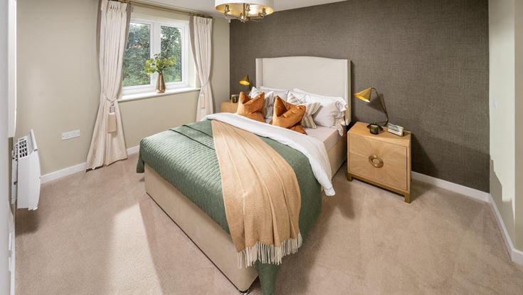 a bedroom with a bed and a lamp