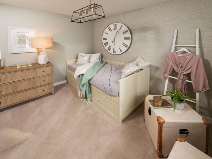 a bed with a clock on it