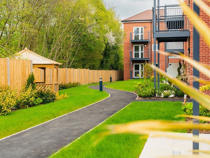 a backyard with a swing set
