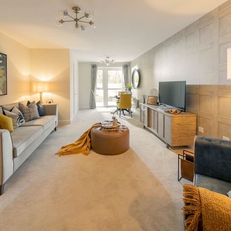 a living room with a couch and a tv
